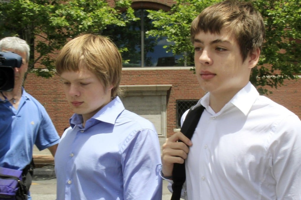 In this July 1, 2010, file photo, Alex Vavilov, right, and his older brother Tim leave a federal court after a bail hearing for their parents in Boston, Massachusetts. The now 23-year-old Alex and brother Tim seek the right to reside permanently in Canada, the country where their parents once lived clandestine lives as deeply embedded Russian spies. Photo: AP