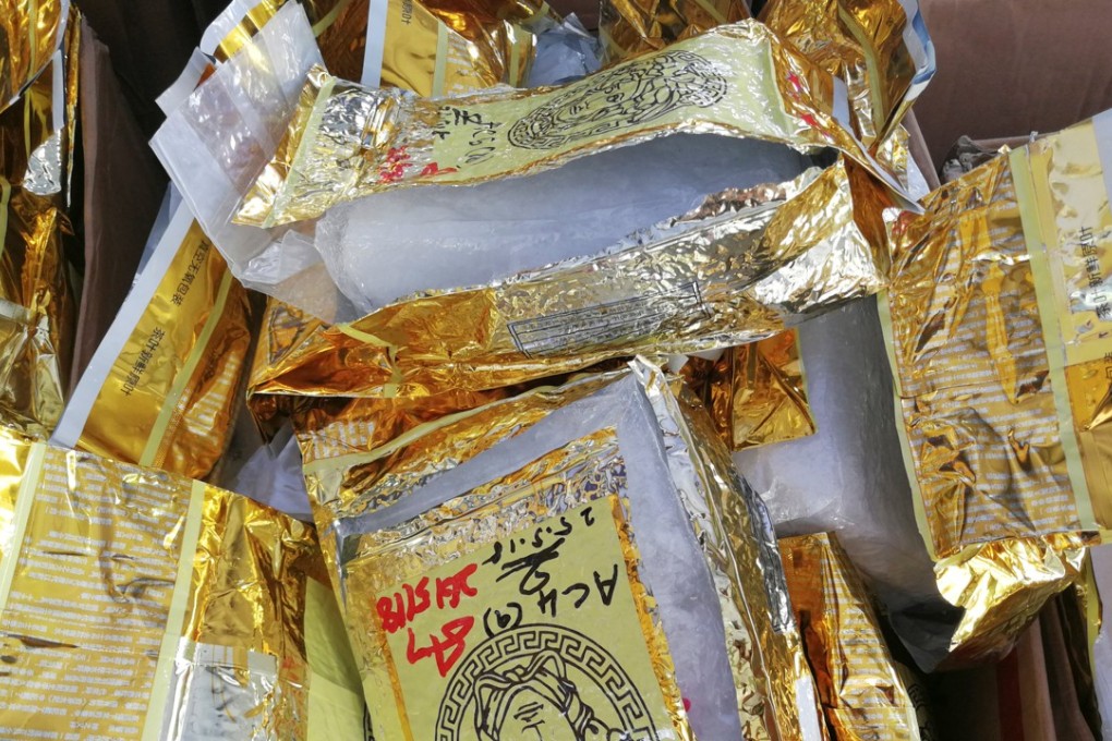 Customs officials displayed the shipment, packed in golden yellow tea packets, at its narcotics operations headquarters in Nilai, near Kuala Lumpur. Photo: Reuters
