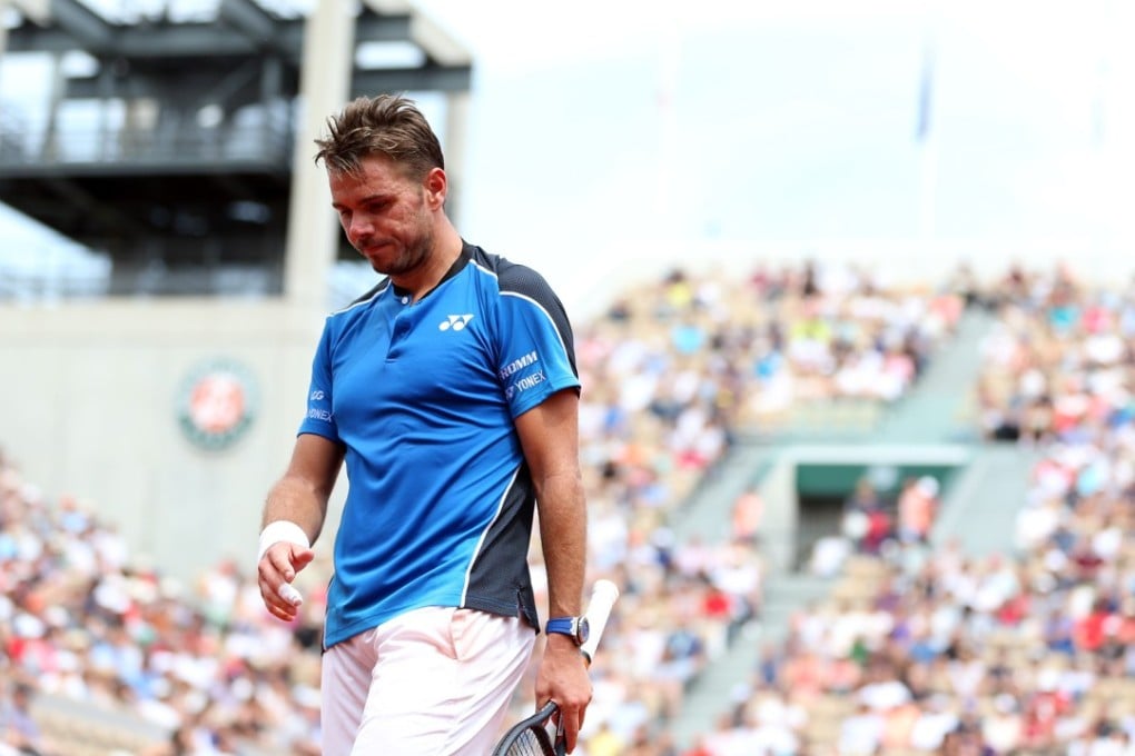 Switzerland’s Stan Wawrinka trudges off the court after losing in the first round of the French Open. Photo: Xinhua