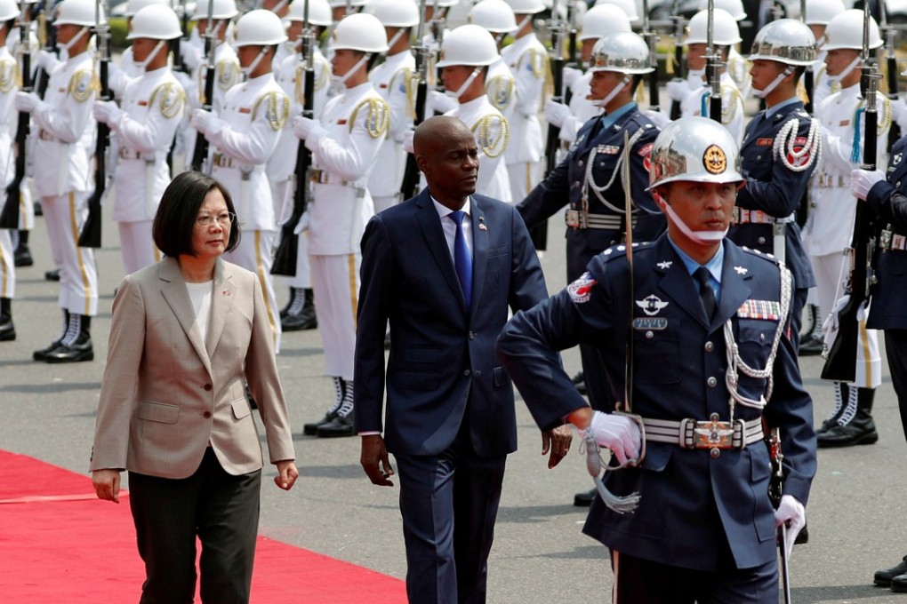 Taiwan's President Tsai Ing-wen (left) pictured with Haitian counterpart Jovenel Moise as they review an honour guard at a welcoming ceremony in Taipei. Photo: Reuters