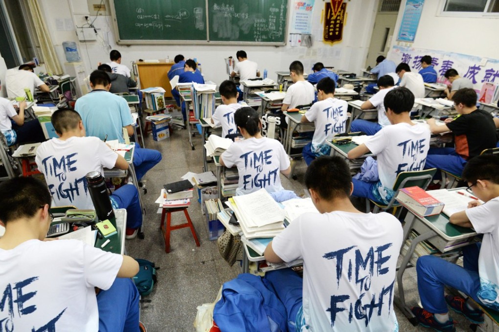 High school students going through exam papers, ahead of their annual gaokao or college entrance examinations in Handan in Hebei province on May 23, 2018. The examinations take place on June 7 and June 8 this year. Photo: AFP