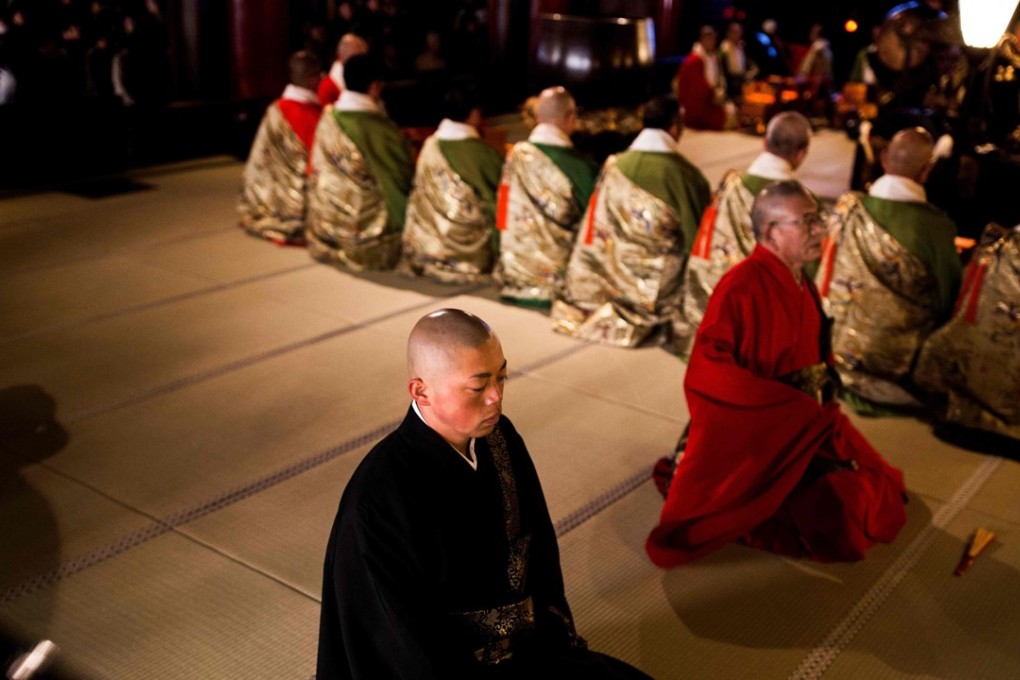 Japanese monks at the Zenkoji Buddhist temple in Nagano. Many temples across Japan are said to be considering opening their doors to holidaymakers with the government loosening laws on private accommodation. Photo: AFP