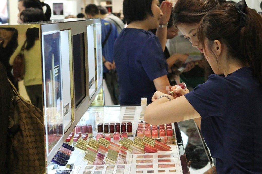 People try beauty products at beauty counters at Times Square, Causeway Bay, in 2012. Physical shops may soon be upgraded with virtual and augmented reality displays. Photo: SCMP