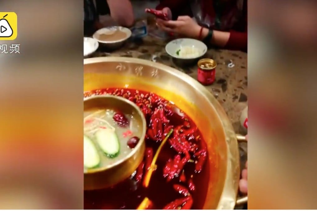 A still from the video report on the hotpot restaurants. Photo: PearVideo