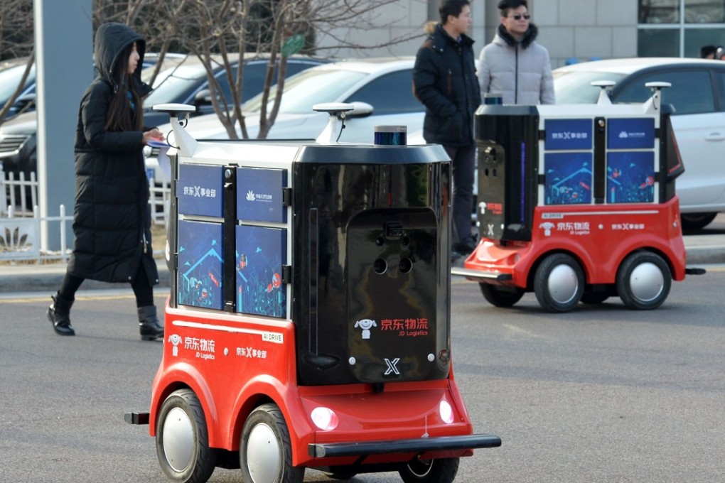 In January JD.com demonstrated these driverless delivery vehicles in the northern Chinese city of Tianjin. It is now moving to introduce unmanned trucks to improve efficiency in logistics operations. Photo: AFP