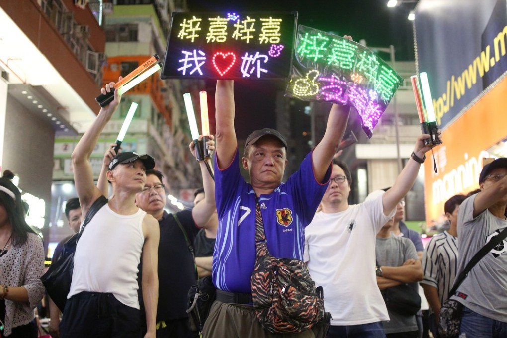 Street performers and passers-by throng the Mong Kok pedestrian zone, days before district councillors voted to shut it down. Photo: Winson Wong