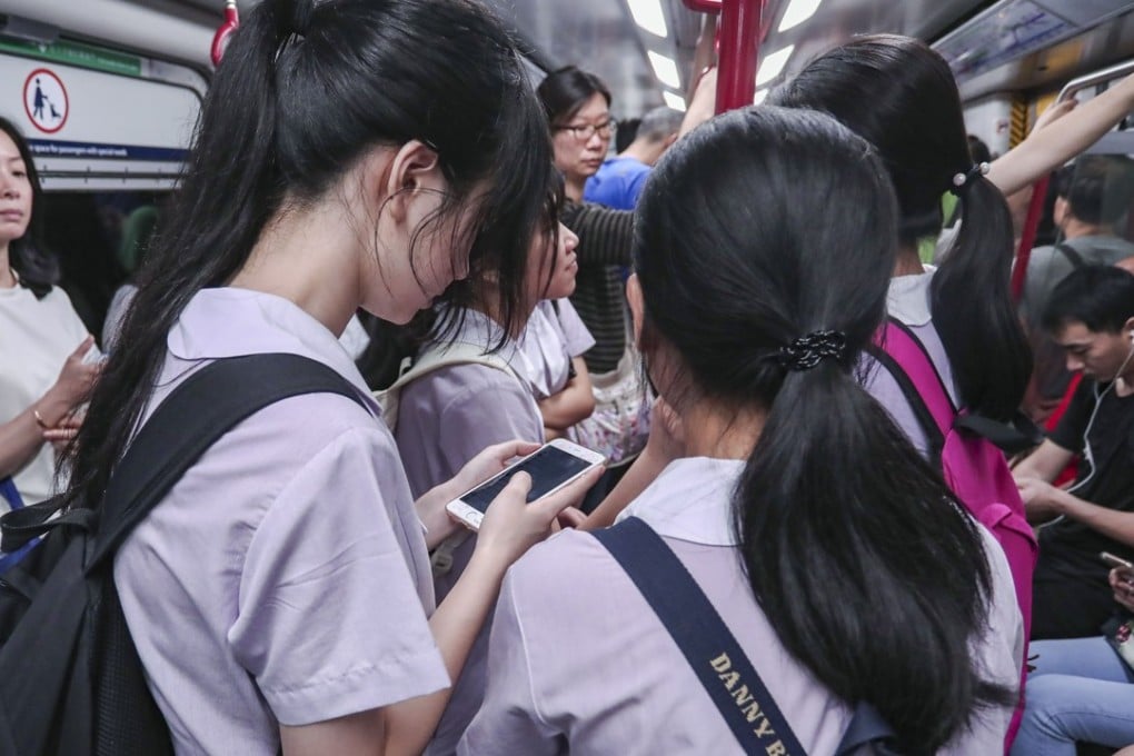 Young students using social media apps may not be fully aware of the need to protect their privacy and the risks of being targeted by online predators. Photo: Jonathan Wong