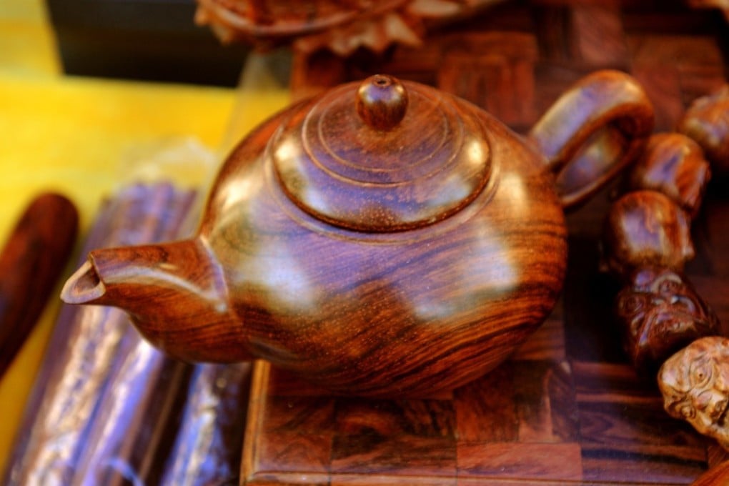 Huanghuali hardwood items such as this teapot can be found in Haikou’s stores.
