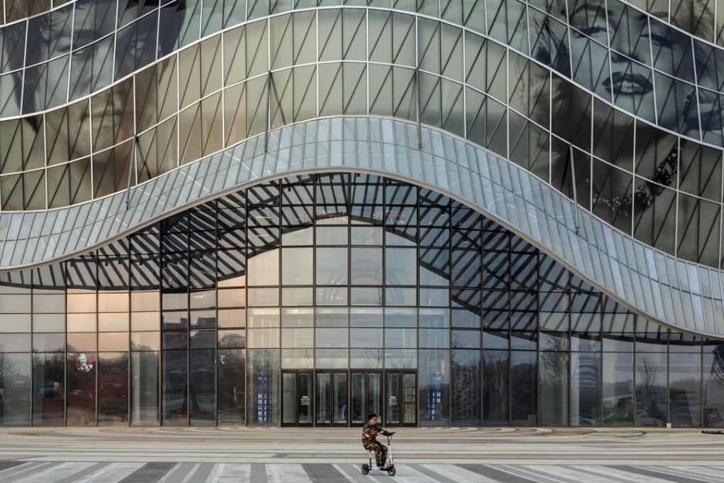 A child rides a scooter at the Dalian Wanda Group Oriental Movie Metropolis film production hub in Qingdao, China, in April 2018. Investors have been unable to keep up with the glut of Chinese property bonds in the market. Photo: Bloomberg