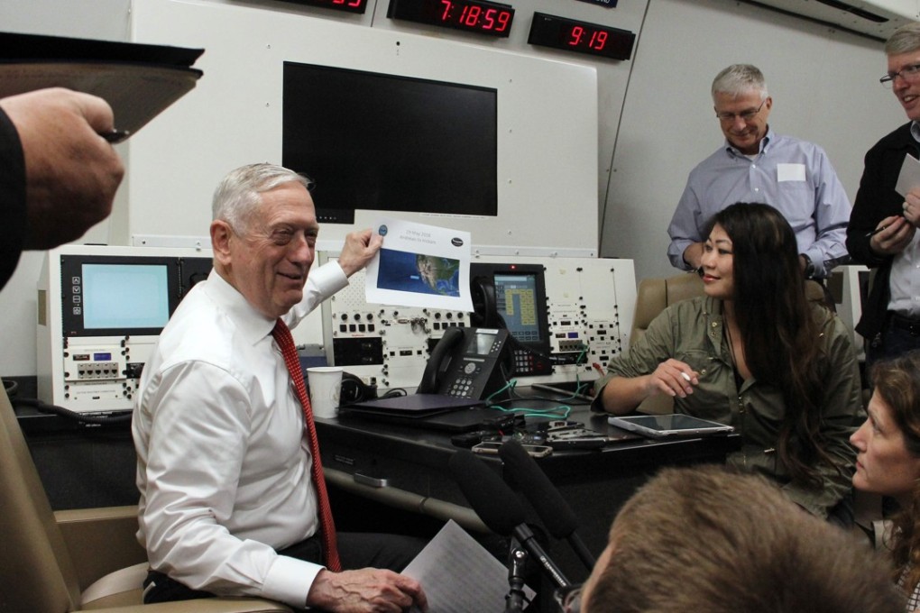 US Defence Secretary Jim Mattis speaks to reporters aboard a military plane its route to Hawaii on Wednesday. Mattis vowed the US would continue confronting China over its territorial claims in the South China Sea. Photo: AFP