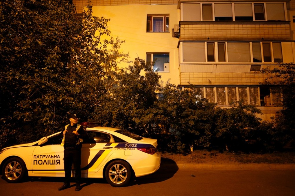 A Ukrainian police officer outside the flat block where Russian journalist Arkady Babchenko was shot in Kiev, Ukraine, on Tuesday. Babchenko died of his wounds en route to a hospital. Photo: Reuters