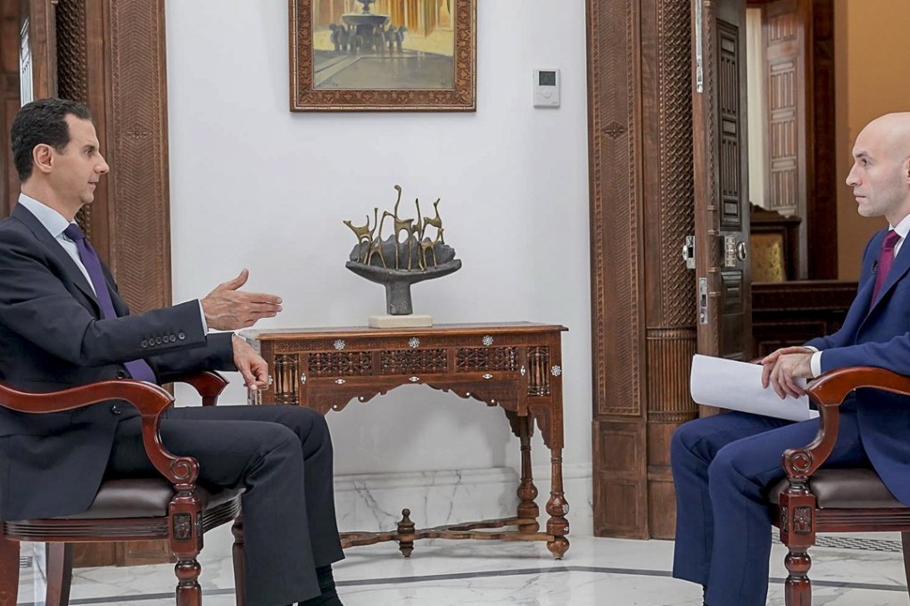 Syrian President Bashar al-Assad speaks with Russian media RT in Damascus. During the interview he issued a thinly veiled warning of a conflict arising with the US if they didn’t get out of the country. Photo: EPA