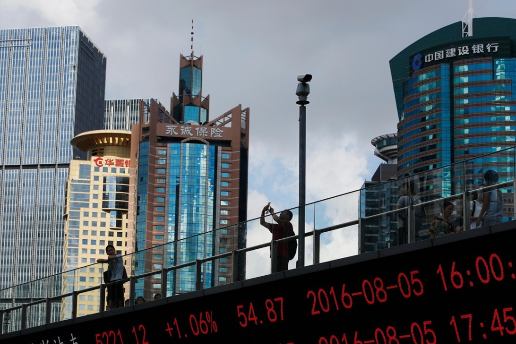 An electronic display shows stock movements in Shanghai, China. Photo: Bloomberg