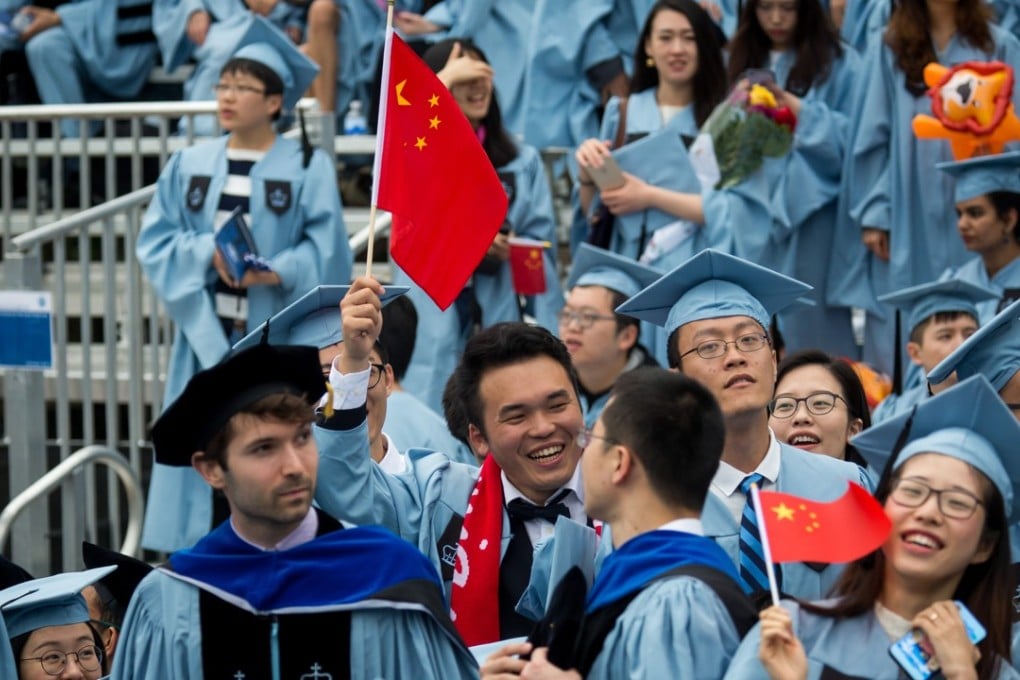Graduates of Columbia University in New York wave Chinese national flags during the commencement ceremony on May 16. Photo: Xinhua