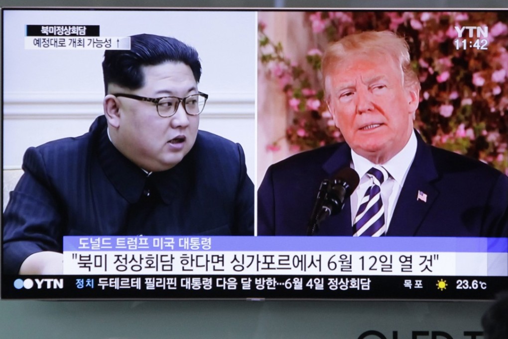 People watch a TV screen at Seoul Railway Station in South Korea showing North Korean leader Kim Jong-un and US President Donald Trump. Photo: AP
