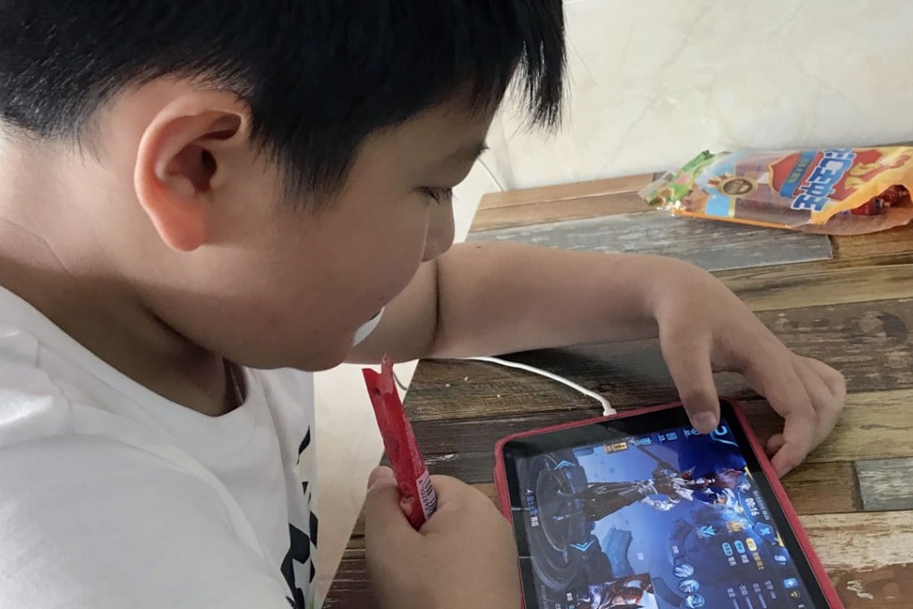 A boy plays Honour of Kings, the most popular multi-player online battle game owned by Tencent Games, in Qianxi county, Guizhou province, on Jul. 6, 2017. 06JUL17 SCMP/Simon Song