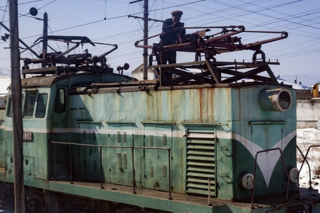 An engineer fine tunes an electric locomotive in North Hamgyong province. Pictures: Ayesha Sitara