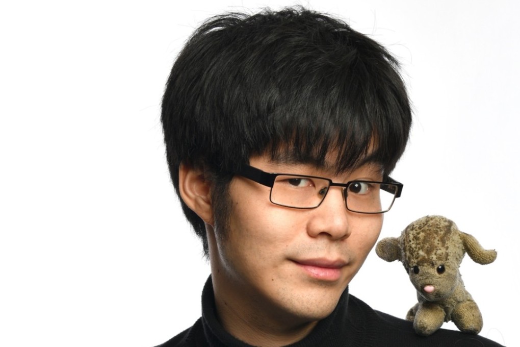 Ken Cheng with one of his toy lambs. Picture: courtesy of Ken Cheng