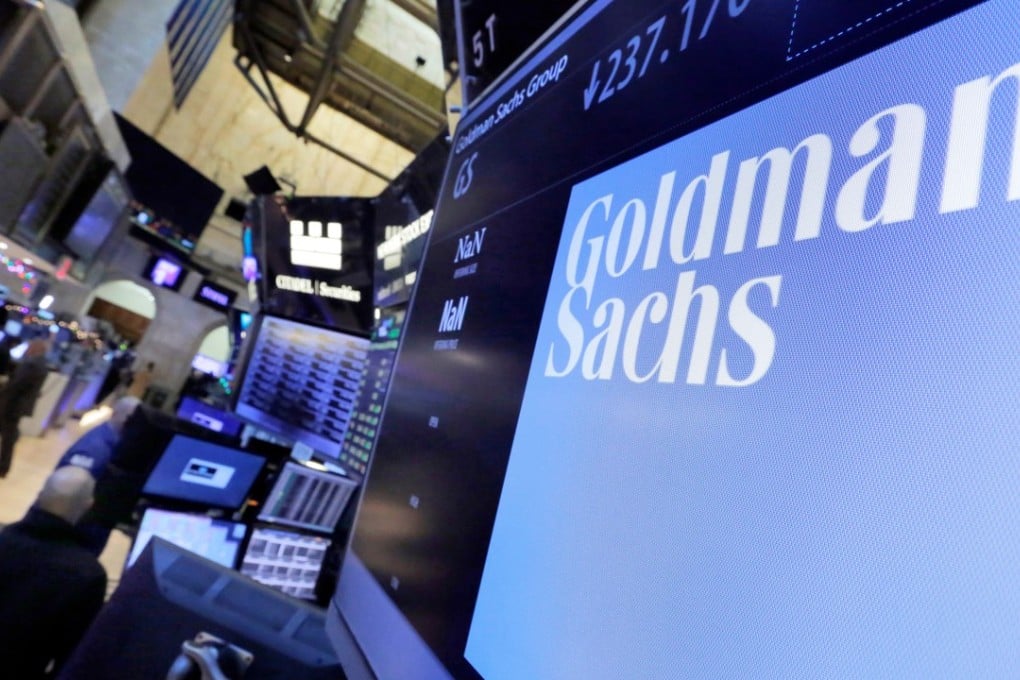 A logo for Goldman Sachs appears above a trading post on the floor of the New York Stock Exchange in 2016. Photo: AP