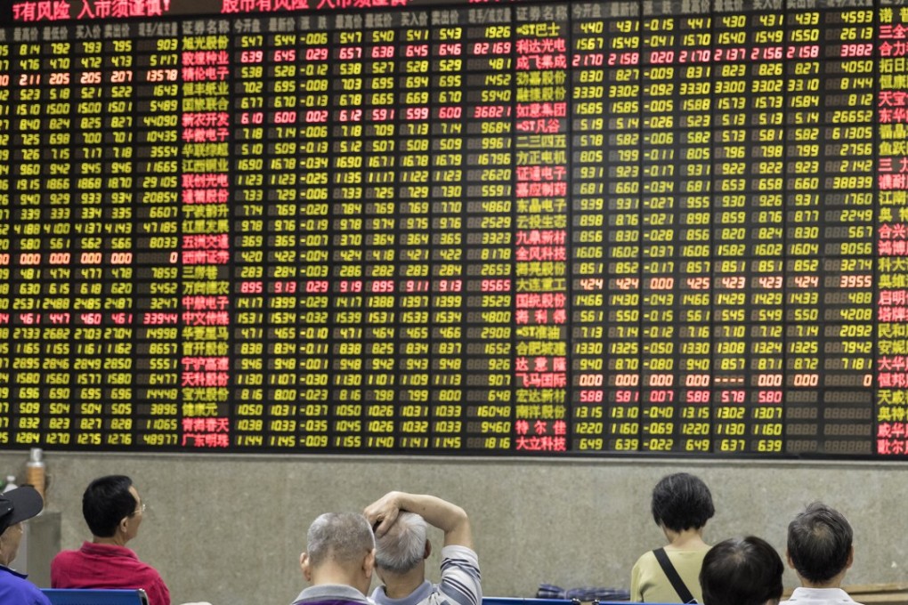 Chinese equity investors at a securities brokerage in Shanghai on Wednesday, May 30, 2018. Contrary to global conventions, China’s stock exchanges and brokerages illustrate declines and losses in green, and use the colour red to denote gains and advances. Photo: Qilai Shen/Bloomberg