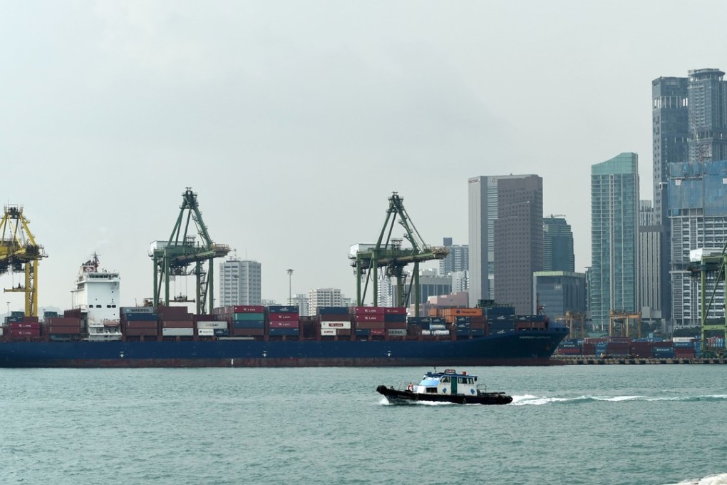 A boat passes the iconic Tanjong Pagar Terminal in Singapore. Photo: AFP