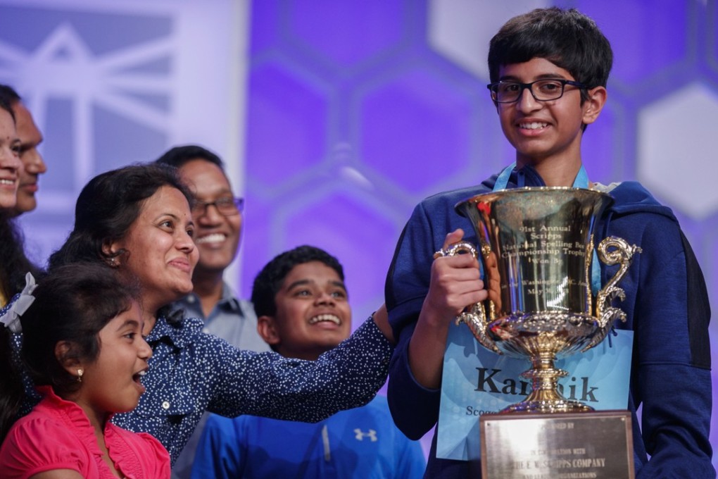 Friends and family rush to congratulate Karthik Nemmani, from McKinney, Texas, winner of the 2018 Scripps US National Spelling Bee in National Harbor, Maryland, on Thursday. Photo: EPA
