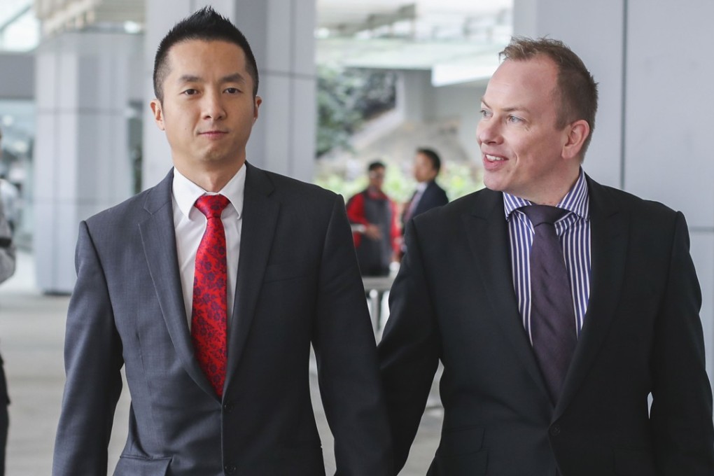 Senior immigration officer Angus Leung (left) with his partner Scott Adams. Photo: Winson Wong