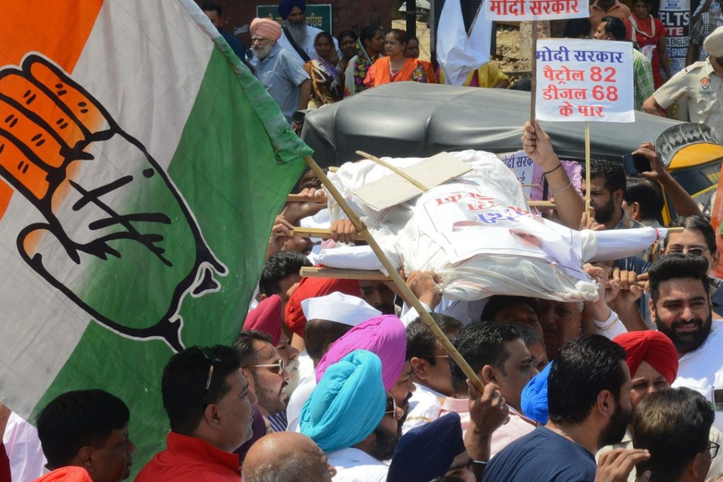 Congress party supporters shout slogans as they carry an effigy of Indian Prime Minister Narendra Modi before burning it during a demonstration in Amritsar on May 26. Photo: AFP