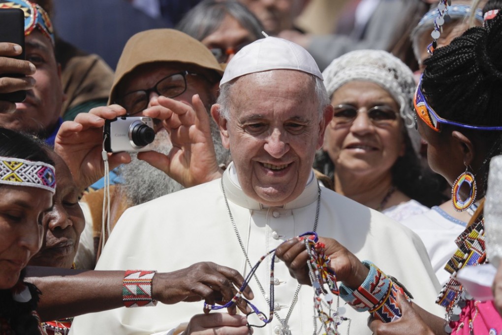 File photo of Pope Francis being given bracelets at the Spirit of The Planet Festival. Photo: AP