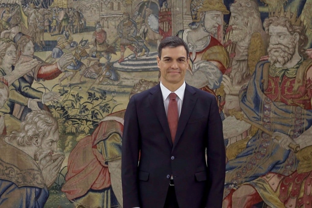 Spain's new Prime Minister Pedro Sanchez smiles during a swearing-in ceremony at the Zarzuela Palace near Madrid. Photo: AP