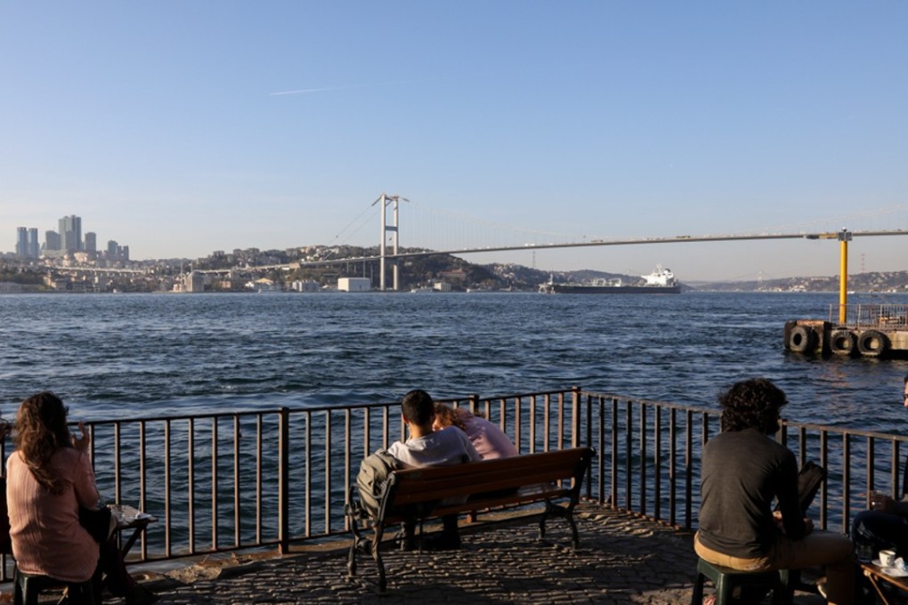 Istanbulites watch on as an oil tanker crosses the Bosphorus. Opponents of the Kanal Istanbul project claim its environmental toll, in the pristine parts of the city, is too heavy to ignore and has not been studied properly. Photo: Hélène Franchineau