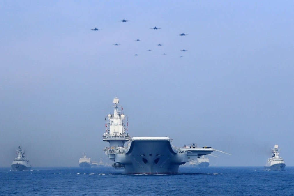 Warships and fighter jets from China’s PLA Navy take part in a military display in the South China Sea on April 12. Photo: Reuters