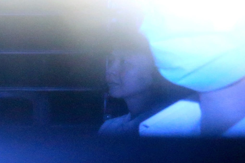 Tang Lin-ling (right) is escorted to the High Court by police. Photo: Dickson Lee