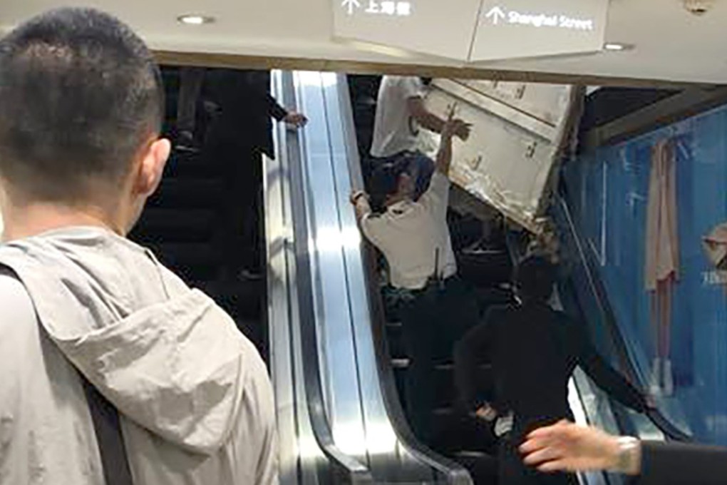 The injured worker was knocked unconscious by the plank in Langham Place mall in Mong Kok. Photo: Facebook