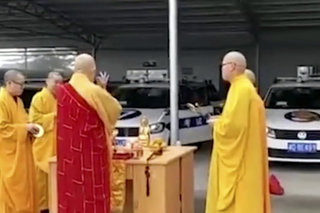 Footage posted online shows five Buddhist monks blessing a new fleet of cars at the Hengyang centre. Photo: Thepaper.cn