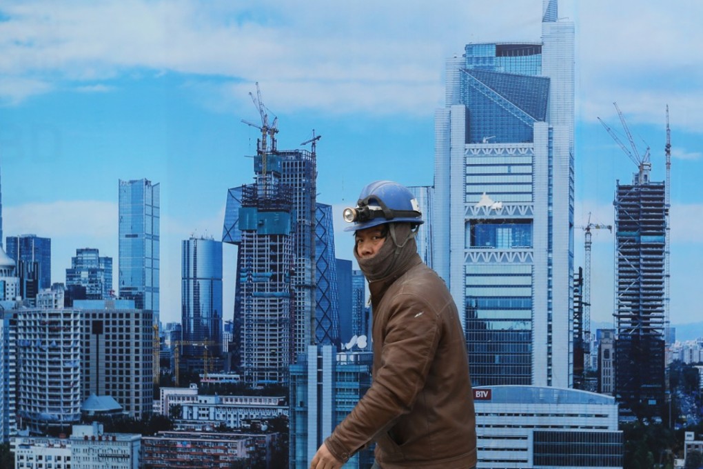 In its report, Fitch said measures taken by the government to bring down borrowing levels will inevitably dent business investment. Photo: EPA