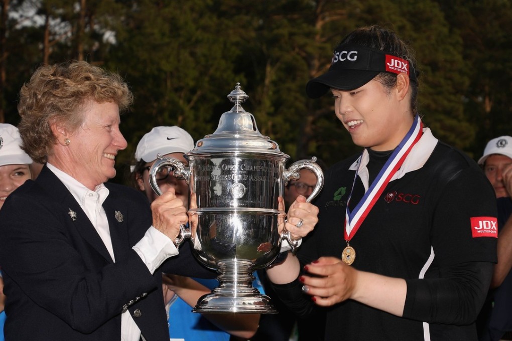 Ariya Jutanugarn of Thailand is awarded the 2018 US Women’s Open trophy after winning in a play-off. Photo: AFP