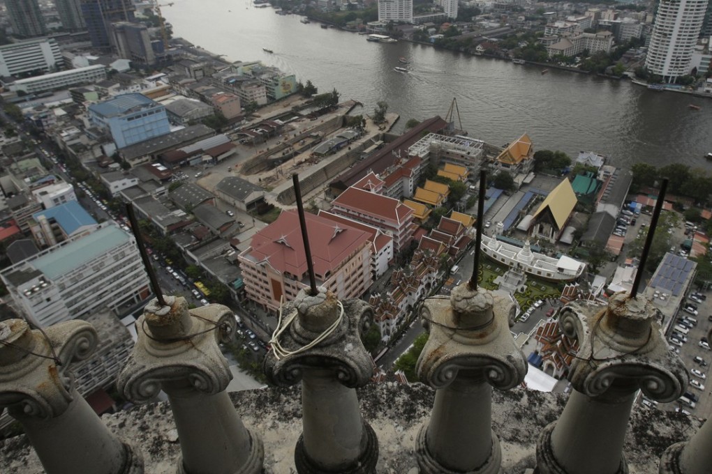 A view of the Chao Phraya River seen from a balcony of the unfinished Sathorn Unique building in Bangkok, Thailand, in January 2017. The 49-storey high-rise was supposed to feature luxury condos for hundreds of newly affluent Thai families, but was abandoned when the Asian financial crisis struck in 1997. Photo: AP