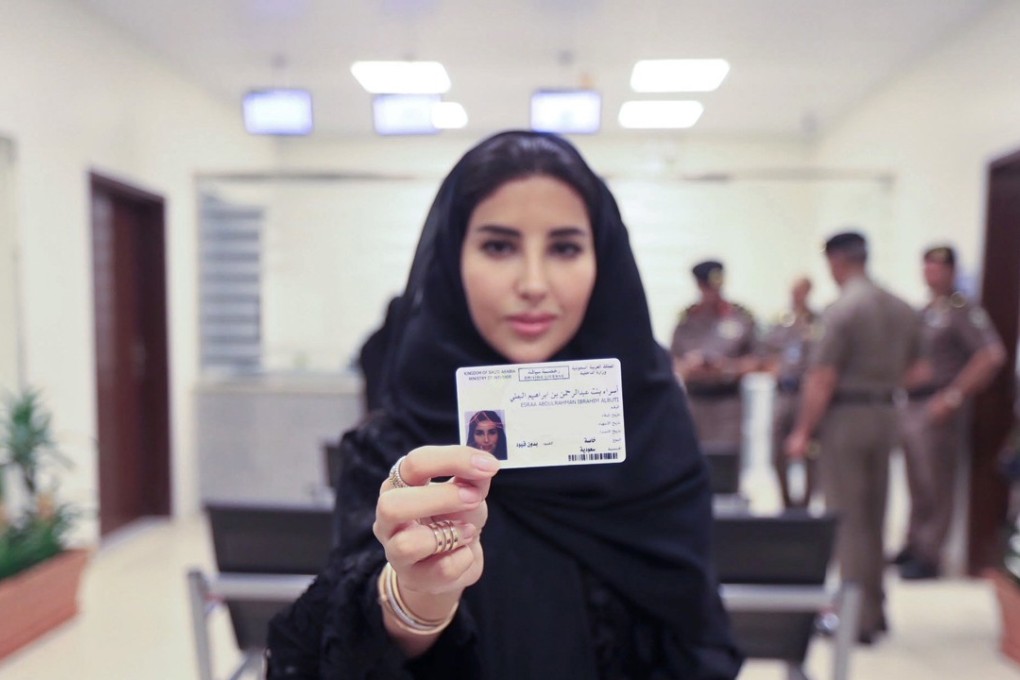 Esraa Albuti, an executive director at Ernst & Young, displays her Saudi Arabian driving licence at the General Department of Traffic in Riyadh. Hers was one of 10 issued to women on Monday before the kingdom lifts the world's only ban on women driving on June 24. But the move comes as a number of women who had campaigned for the right to drive remain under arrest. Photo: Saudi Information Ministry via AP