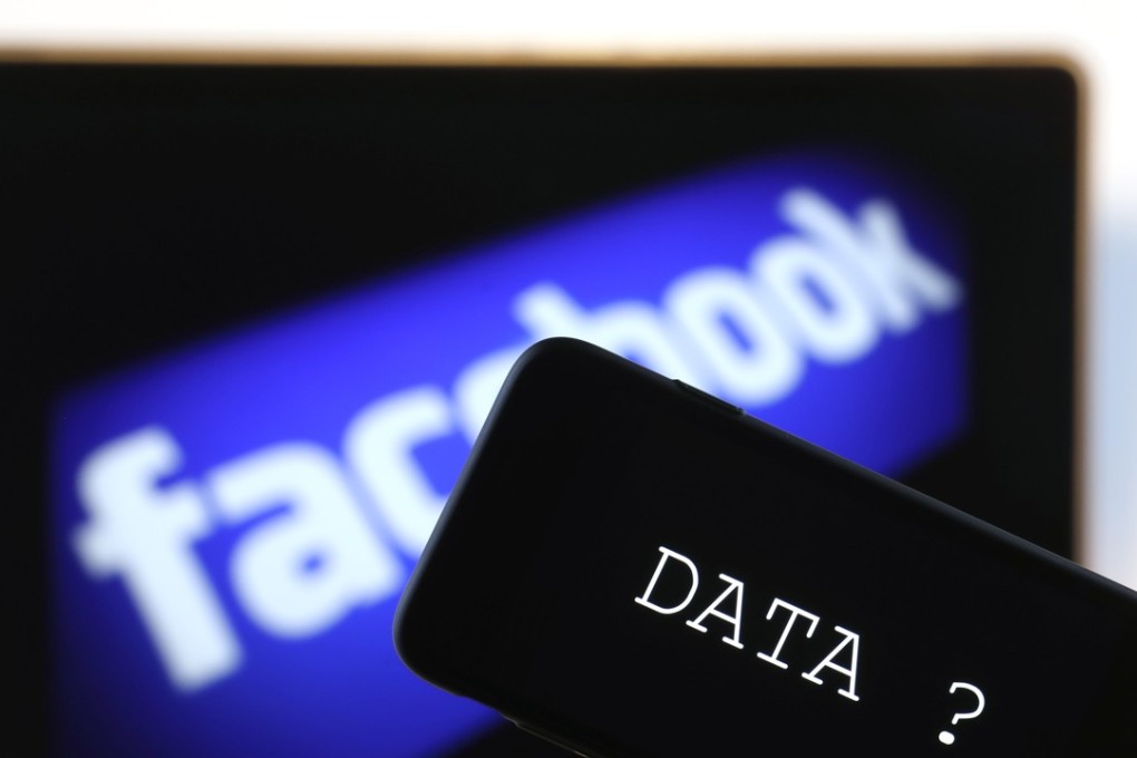 The screen on an Apple iPhone displays the word data against a backdrop of the Facebook logo. Photo: Bloomberg