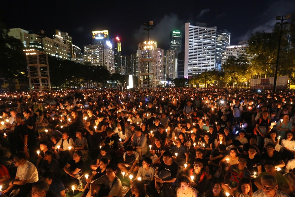 The atmosphere was peaceful as attendees, many dressed in black, sang patriotic songs. Photo: Dickson Lee