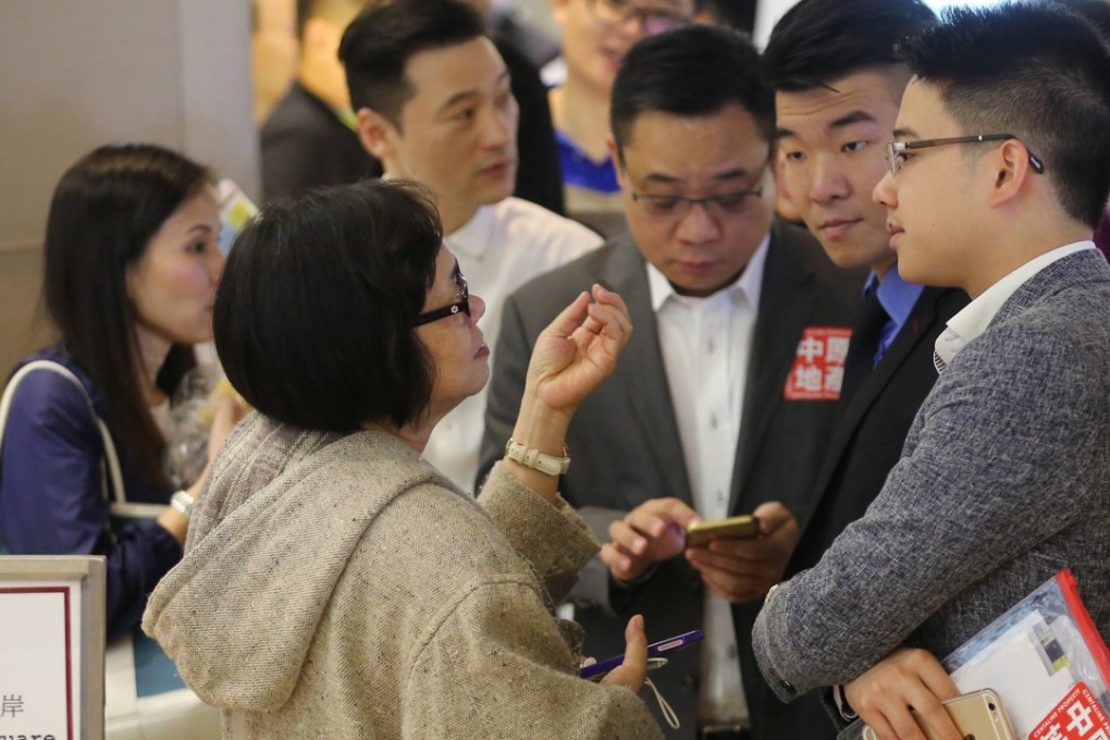 Potential buyers waiting at IFC for a Henderson Land's sale. Photo: Edward Wong