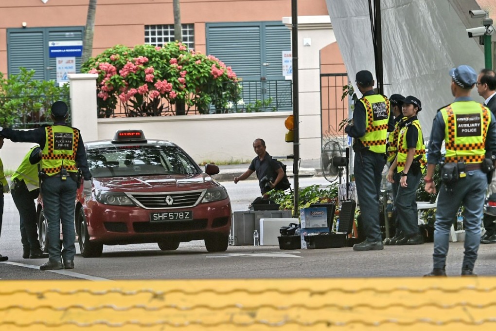 Vehicles entering the Shangri-La hotel in Singapore are checked by security personnel. Photo: AFP