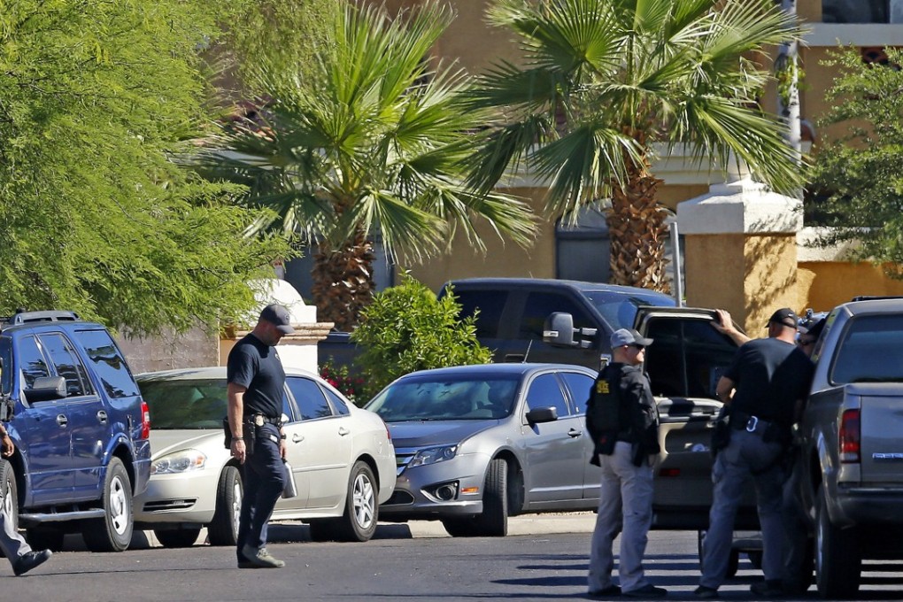 Police surround a hotel where a suspect wanted in multiple killings was staying on Monday in Scottsdale, Arizona. Photo: AP