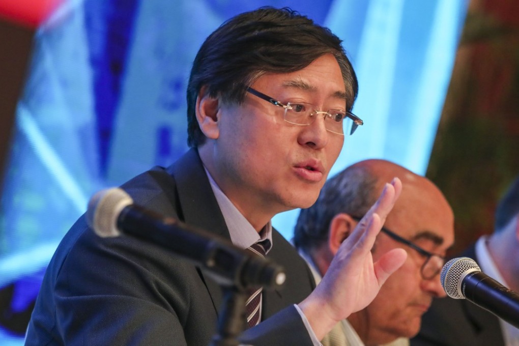 Yang Yuanqing (left), chairman and CEO of Lenovo, speaks during a press conference in Hong Kong on May 24. Photo: Jonathan Wong
