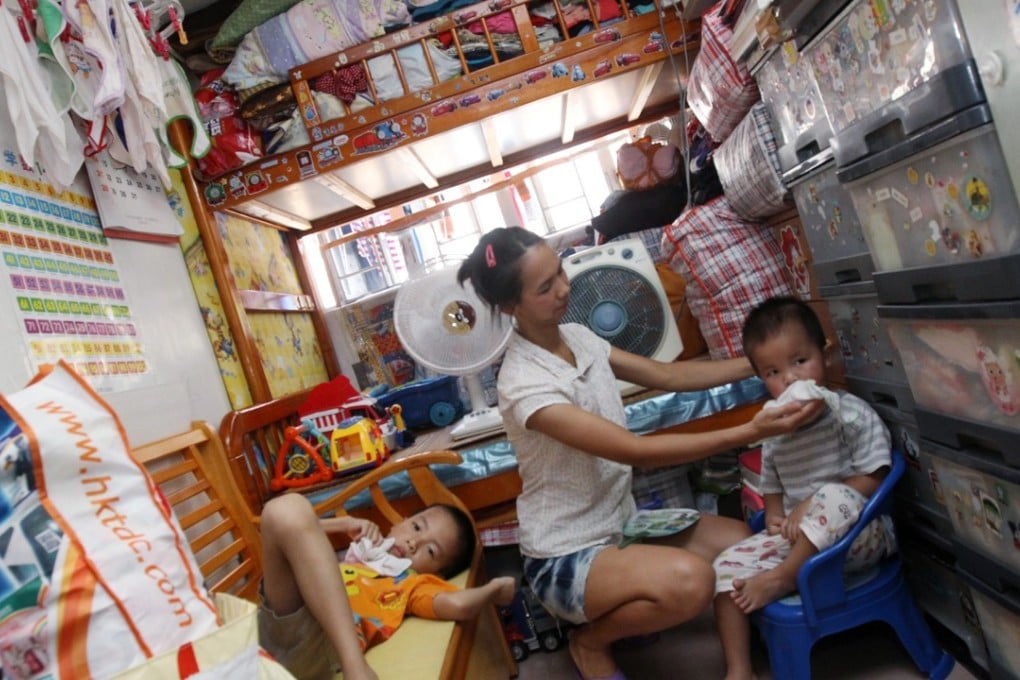 A young family in a subdivided flat in Kwun Tong. Indoor summer temperatures in such units have been shown to be up to five degrees higher than outside. Photo: David Wong