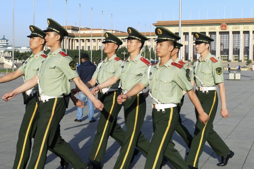 Police officers patrol Beijing's Tiananmen Square on Monday, the 29th anniversary of China's bloody military crackdown on pro-democracy demonstrators. Photo: Kyodo