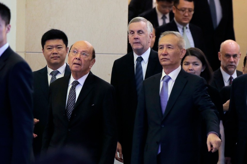 US Commerce Secretary Wilbur Ross (third from left) and Chinese Vice Premier Liu He arrive to attend a meeting at the Diaoyutai State Guesthouse in Beijing on Sunday. Photo: AFP