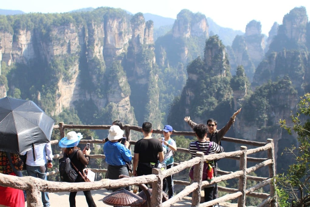Tourists on Yuanjiajie viewing platforms in Zhangjiajie National Forest Park. Photo: Ed Gerstner