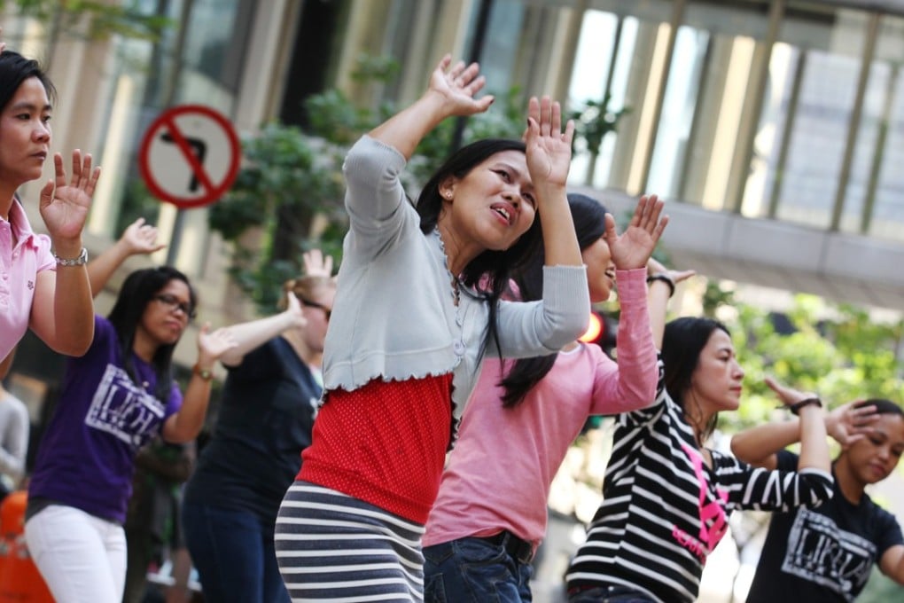 Filipino maids gather on a Sunday in Chater Road, in Central. Domestic helpers customarily gather on weekends and public holidays to relax with their peers, but a Hong Kong lawmaker recently called their gatherings an inconvenience for the general public and an “environmental hygiene” problem. Photo: Nora Tam